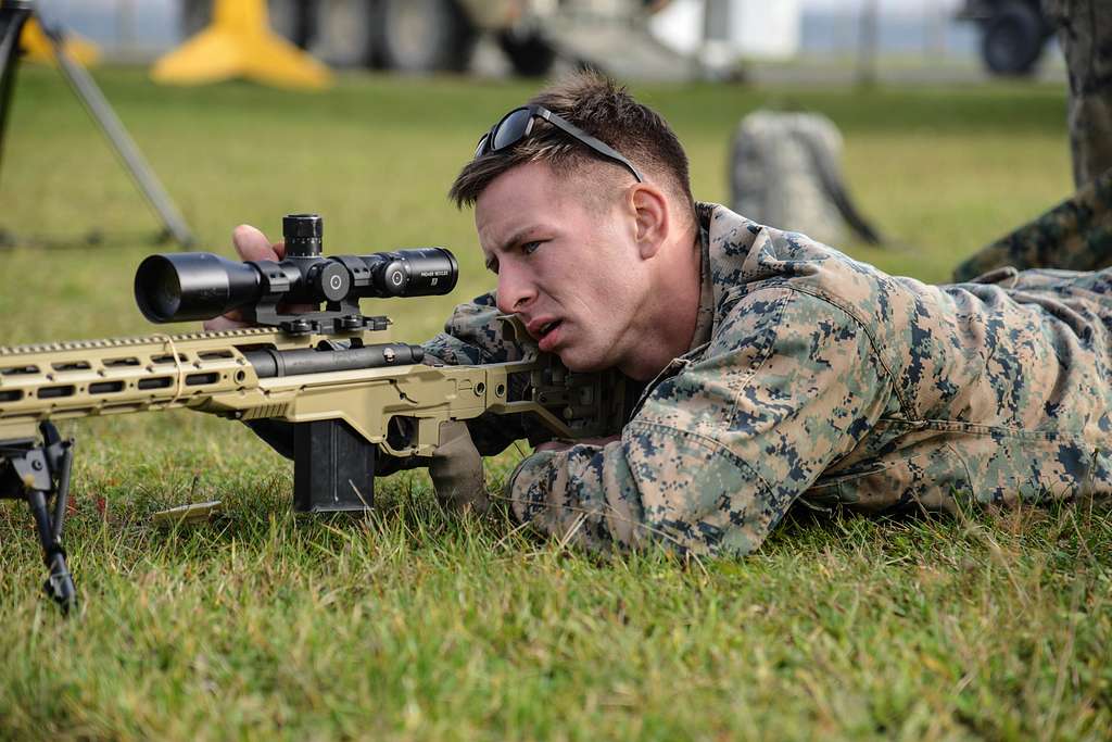 A U.S. Marine makes a sight adjustment before firing - NARA & DVIDS ...