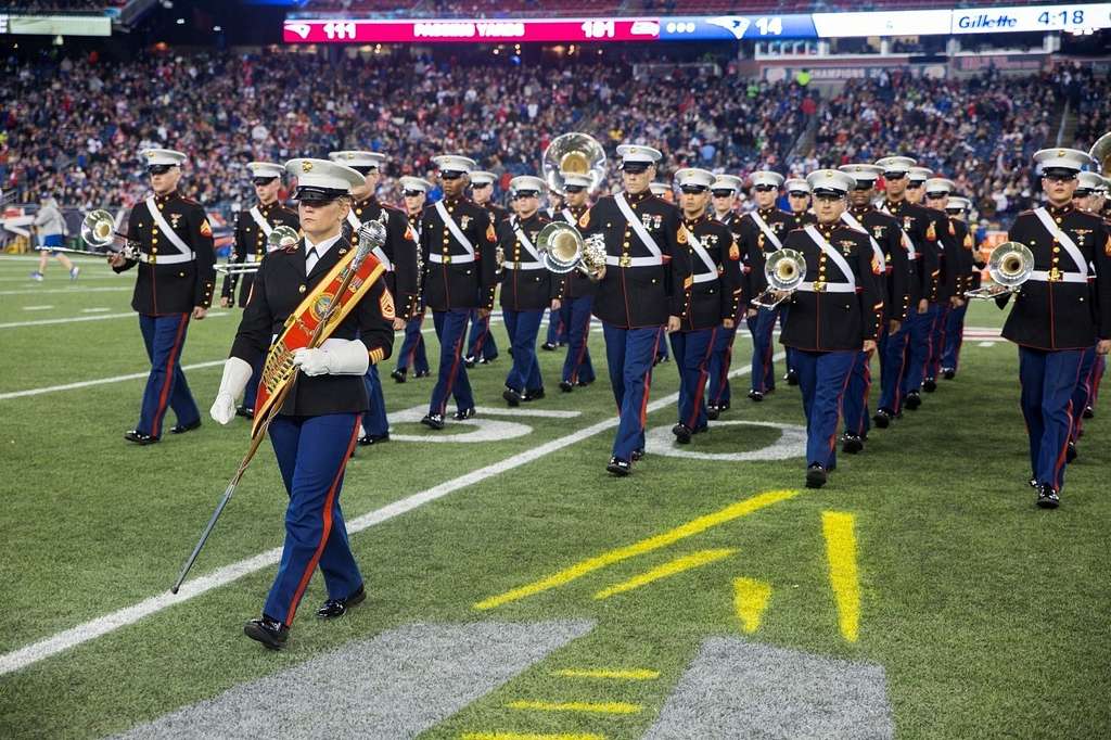 Julian Edelman, wide receiver for the New England Patriots, shakes the  hands of Marines from Marine Corps Band New Orleans before the start of the  game against the Seattle Seahawks at Gillette