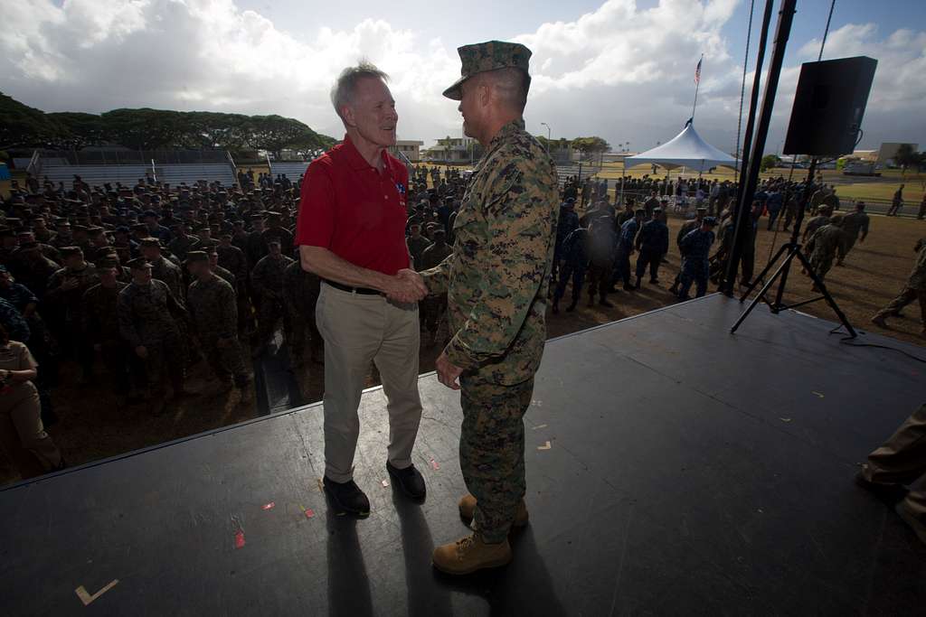 Navy Secretary Ray Mabus shakes the hands of the female service