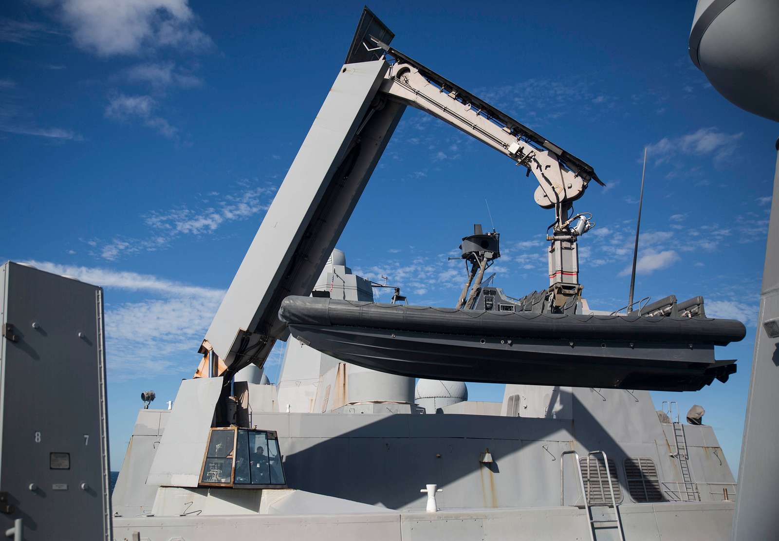 A knuckle-boom crane lifts a rigid hull inflatable - NARA & DVIDS ...