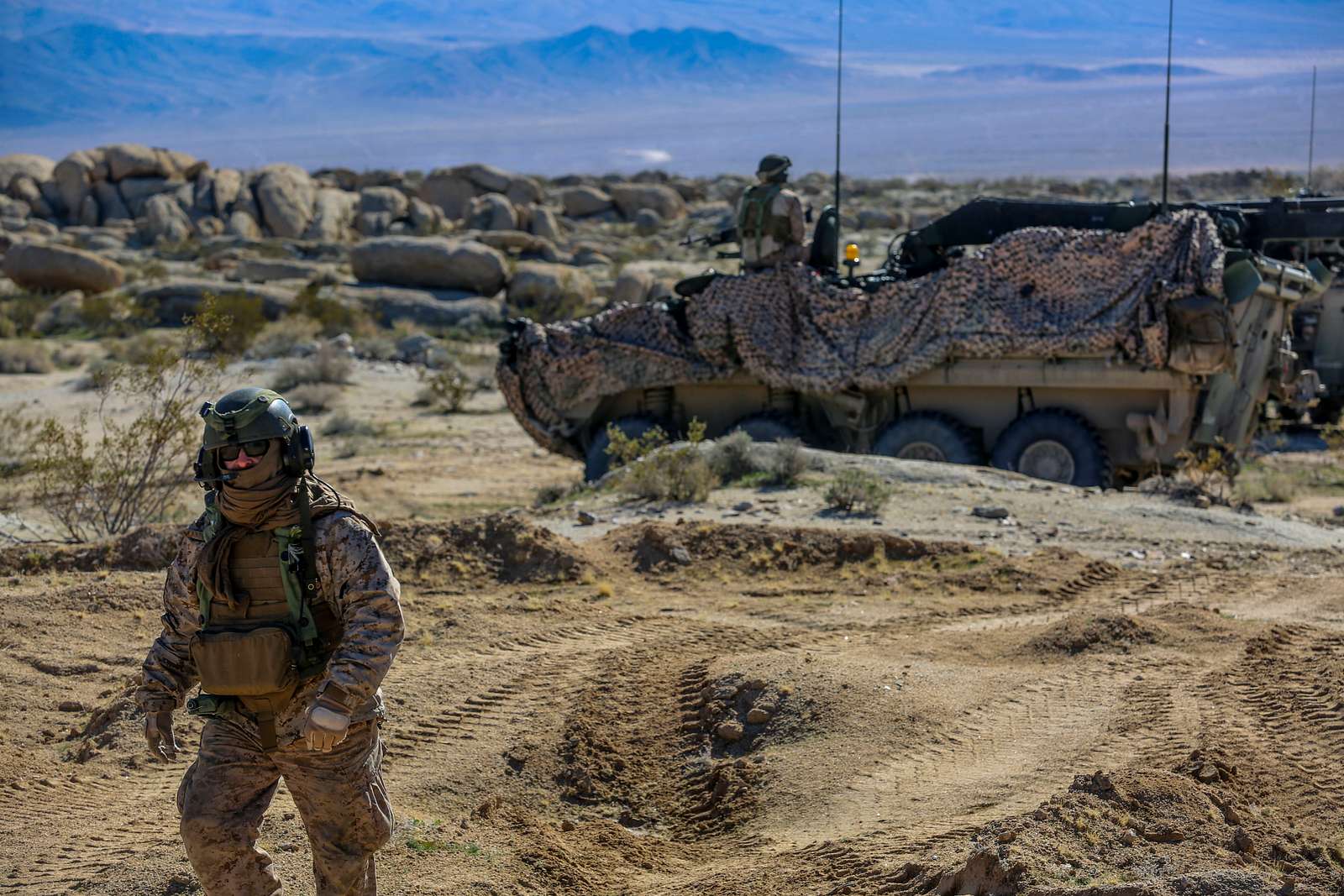 Sgt. 1st. Class. Richard Erskine, a jumpmaster for 1st Brigade Combat Team,  82nd Airborne Division, demonstrates how to properly hook up his static line  during a pre-jump class at Robert Gray Army