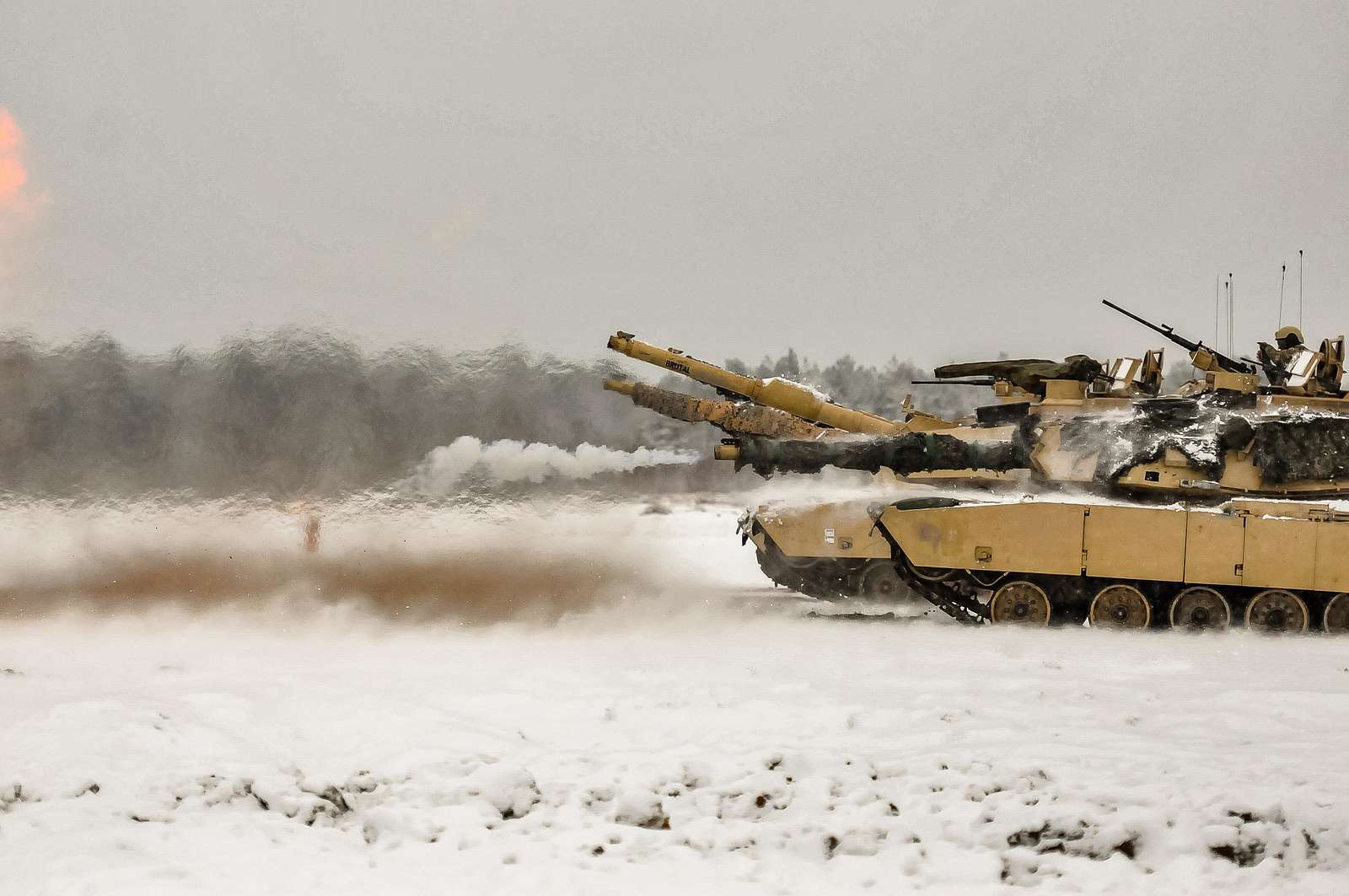 A round is fired from an M1A2 Main Battle Tank belonging - NARA & DVIDS ...