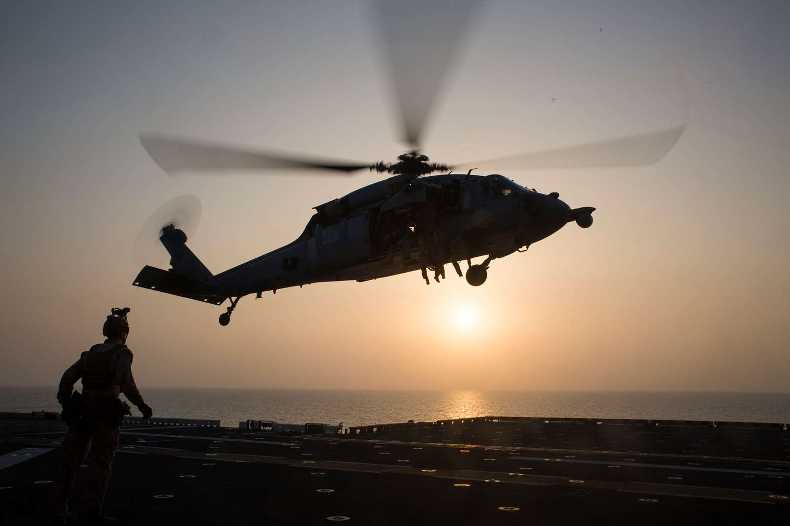 A U.S. Navy SH-60 Sea Hawk helicopter carrying Maritime - NARA & DVIDS ...