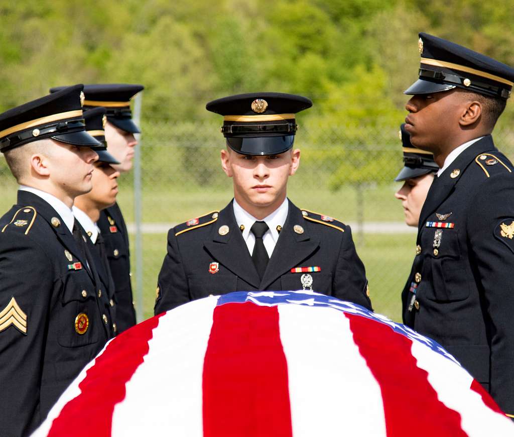 Army Spc. Stephen Drolet, a Soldier in the Massachusetts National Guard,  takes aim with a rifle during the 80-hour, Train-the-trainer Military  Funeral Honors course at Camp Smith Training Site May 11, 2017.