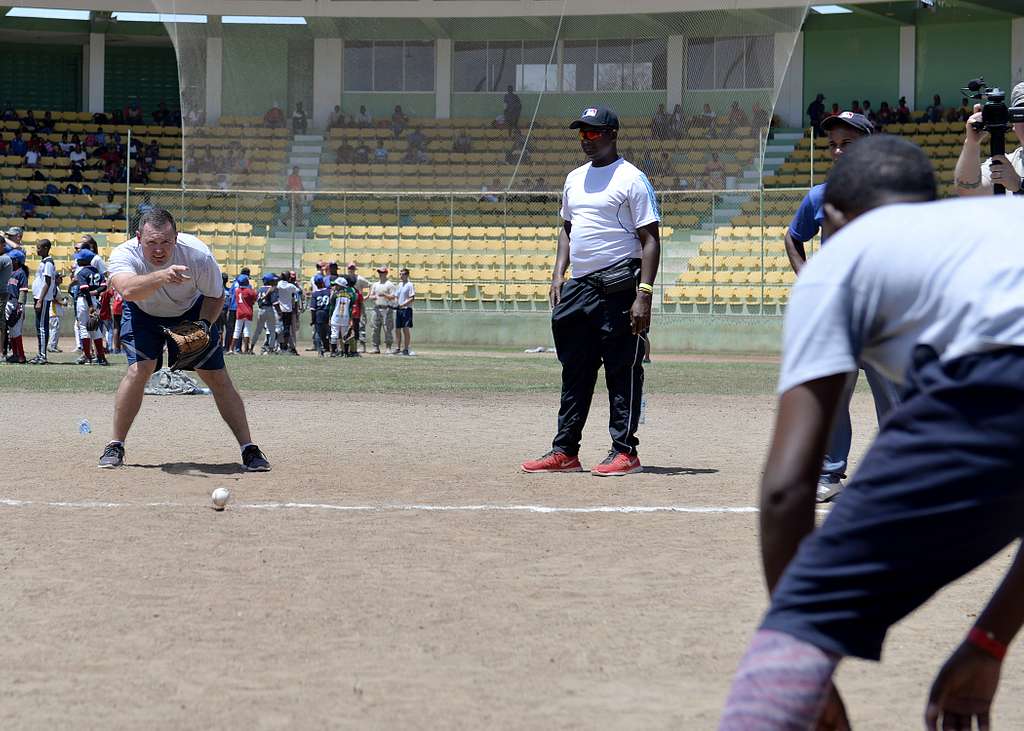 Miguel Descartes Batista Jerez, a retired Major League Baseball player from  the Dominican Republic, coaches participants on pitching form during a  baseball clinic the task force hosted for area children May 20