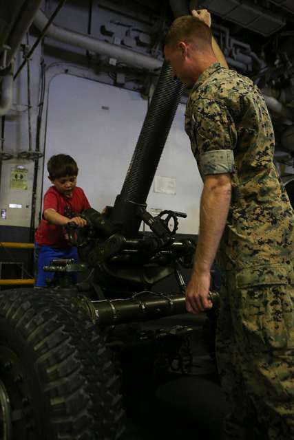 A Young Visitor Checks Out The Weapons Systems On Display Nara