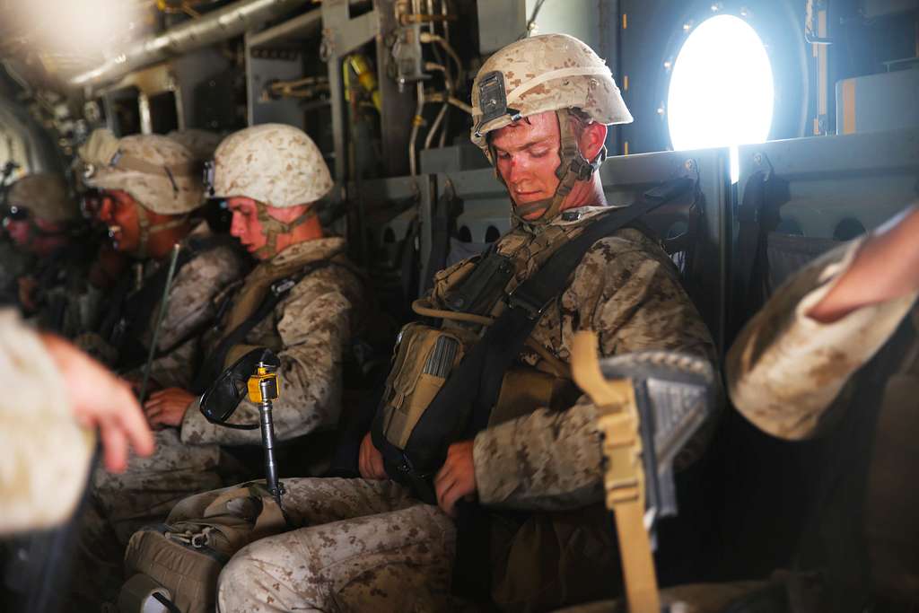 A Navy Corpsman with 3rd Marine Regiment fastens his - NARA & DVIDS ...