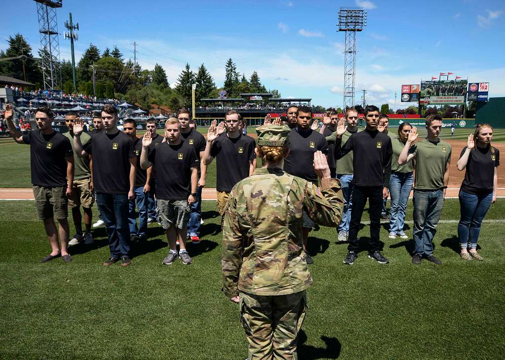 Joint Base Lewis-McChord - Tacoma Rainiers' mascot Rhubarb runs along the  third base line at Cheney Stadium with the American flag moments before the  singing of the National Anthem. DoD photo by