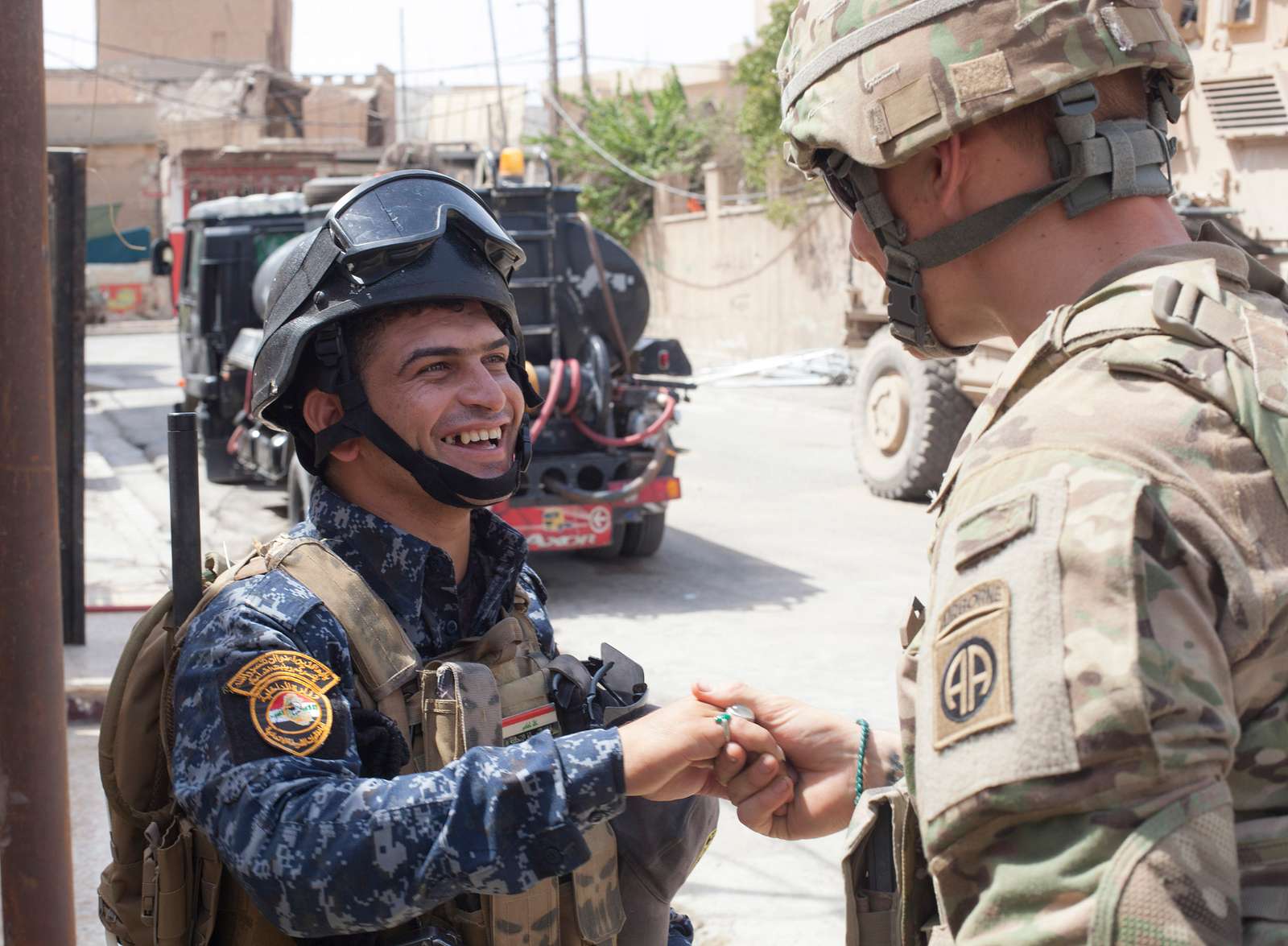 An Iraqi Federal Police member shows his ring to a - NARA & DVIDS ...