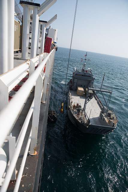 A US Army Landing Craft Utility (LCU) 2000 moors alongside - NARA