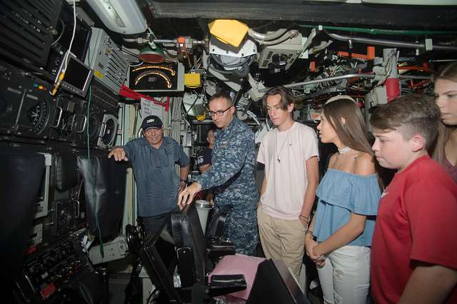 Capt. David Schappert, left, commander of Submarine Squadron 15, observes  the Japan Maritime Self-Defense Force submarine JS Soryu (SS-501) as it  arrives in Apra Harbor, Guam, for a port visit. - PICRYL 