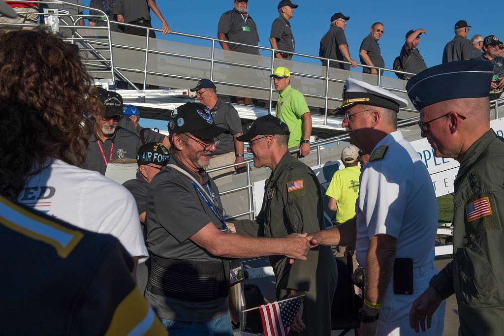 170728-N-CU914-329 GREEN BAY, Wis. (July 28, 2017) – David Robinson Jr.,  Command Master Chief, USS Green Bay (LPD 20), presents Green Bay Packers  linebacker Clay Matthews III with a ship's ball cap