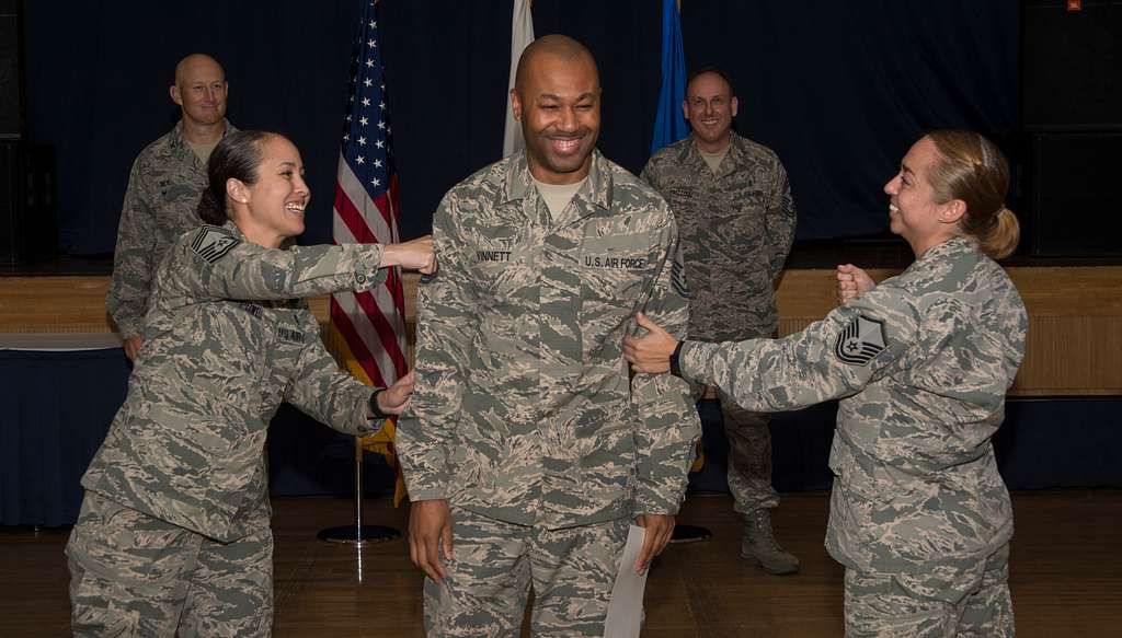 An Airman receives their certificate of promotion at - NARA & DVIDS ...