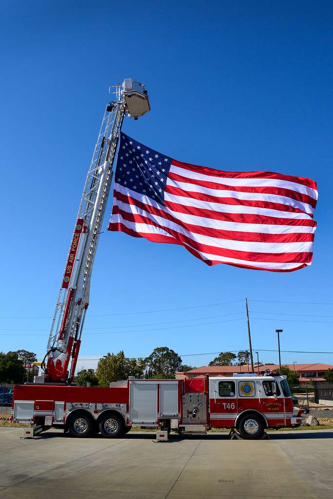 An American flag is attached to the ladder of a fire - NARA & DVIDS ...