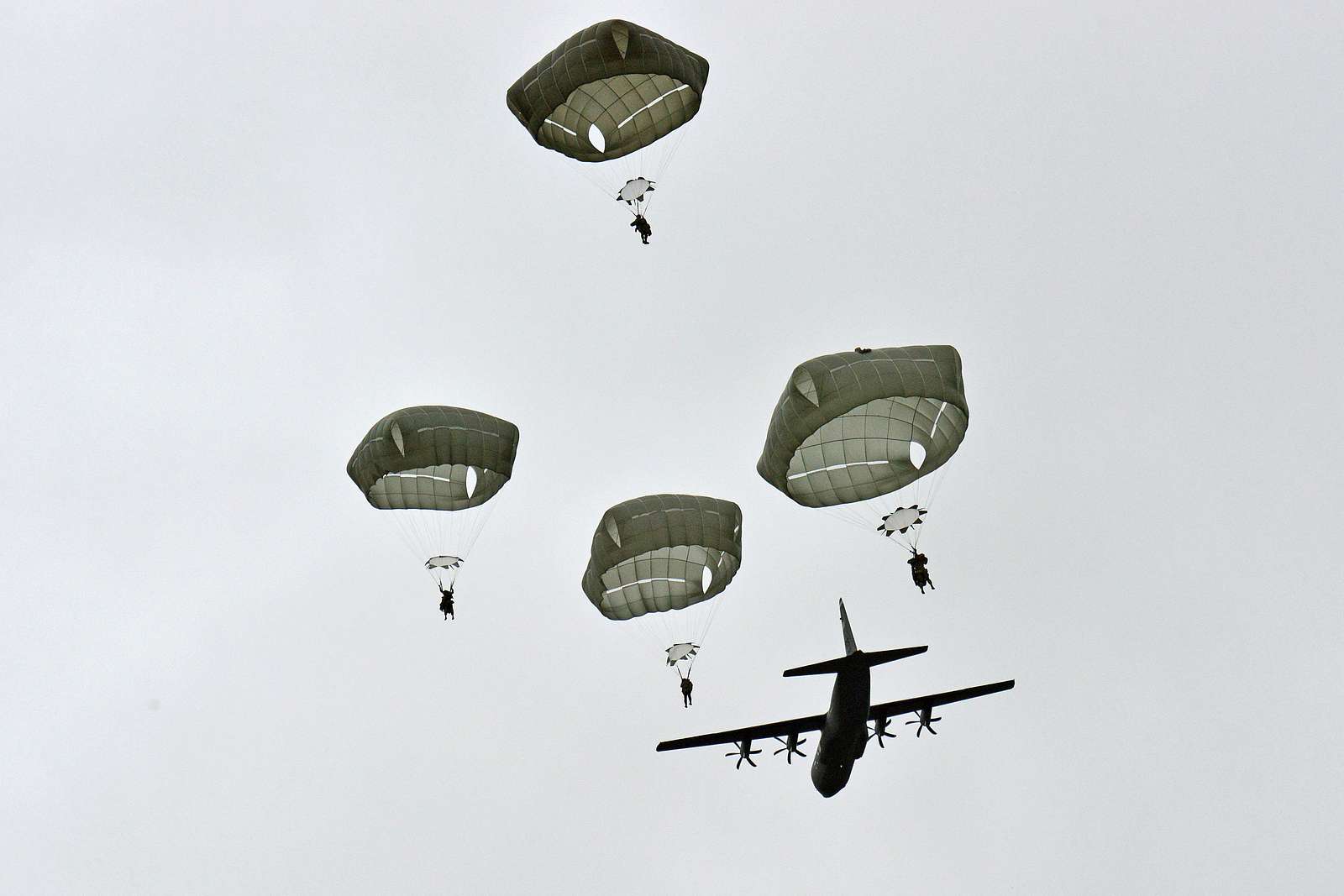 The tail of the US Air Force C-17 Globemaster reaches to the stormy sky as  paratroopers from the 173rd Airborne Brigade board the aircraft to conduct  a parachute assault onto Juliet Drop