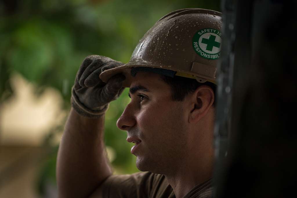 U.S. Navy BU2 Kevin Geiger Readjusts His Hard Hat After - NARA & DVIDS ...