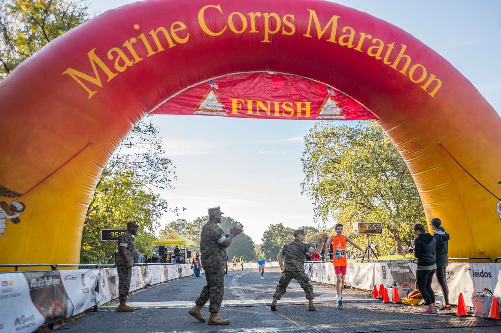 A participant of the Marine Corps Marathon 10K crosses NARA & DVIDS