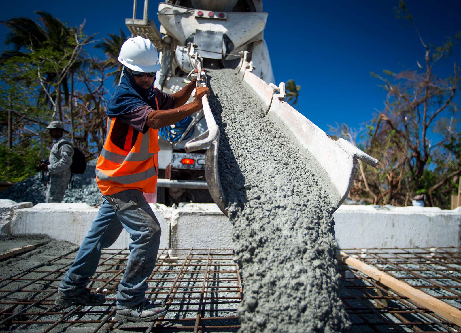 Employees of the Del Valle Group, S.P., pour concrete - U.S. National  Archives &amp; DVIDS Public Domain Search