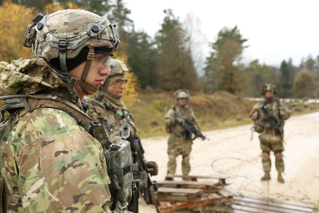 U.S. Army Soldiers stand guard at a road checkpoint - NARA & DVIDS ...