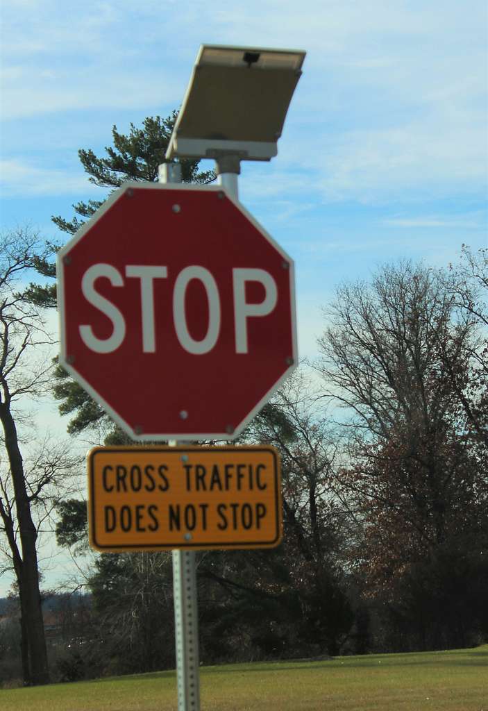 A flashing stop sign powered by solar energy is shown - PICRYL - Public ...