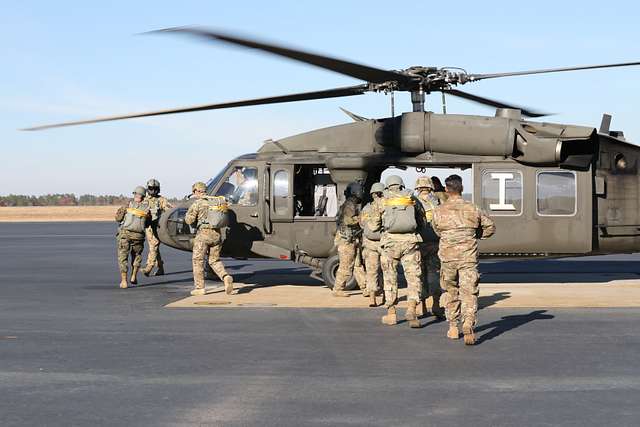 U.S. Army Paratroopers board the UH-60 Blackhawk helicopter, - NARA ...