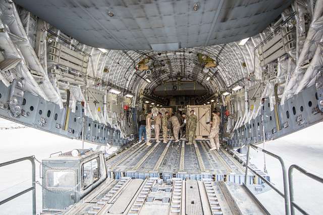 Equipment is loaded into the cargo bay of a C-17 Globemaster - PICRYL ...