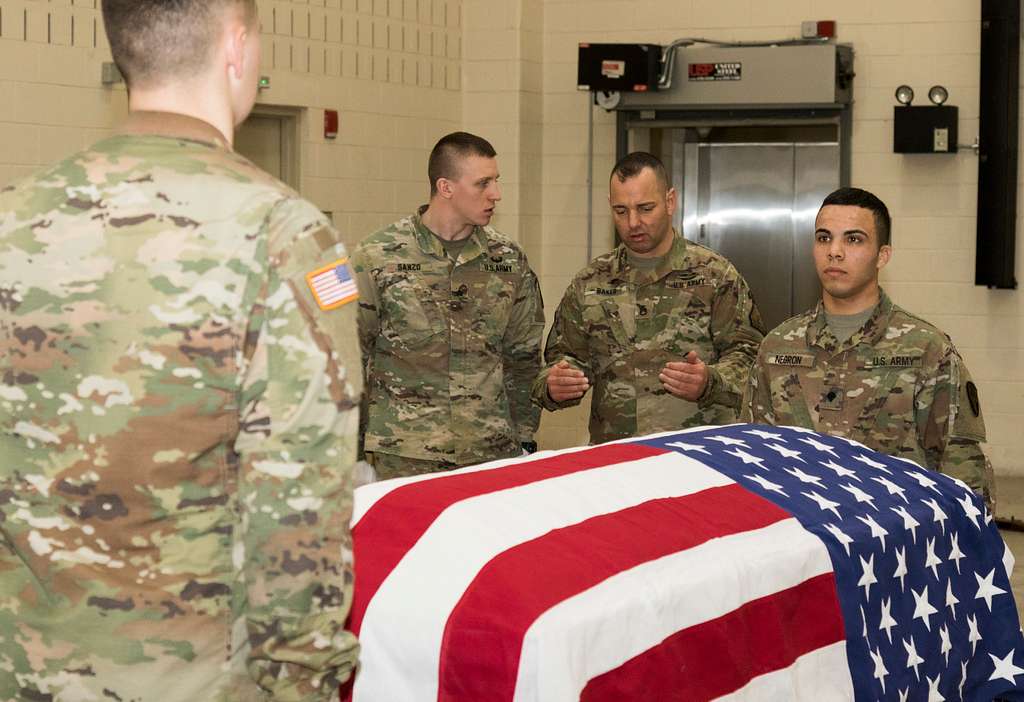 Army Spc. Stephen Drolet, a Soldier in the Massachusetts National Guard,  takes aim with a rifle during the 80-hour, Train-the-trainer Military  Funeral Honors course at Camp Smith Training Site May 11, 2017.