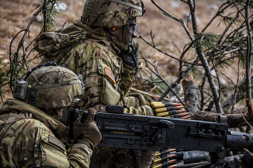 An assistant gunner feeds .50 cal. rounds as the gunner - NARA & DVIDS ...