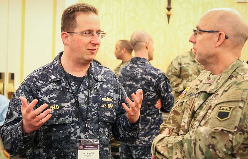 Navy Capt. Derek Feld (left), a naval Emergency Preparedness - PICRYL ...