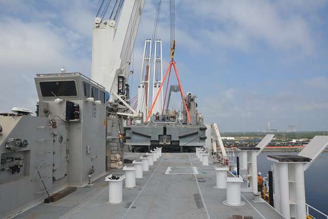 The warping tug is carefully lowered into place on - PICRYL Public ...