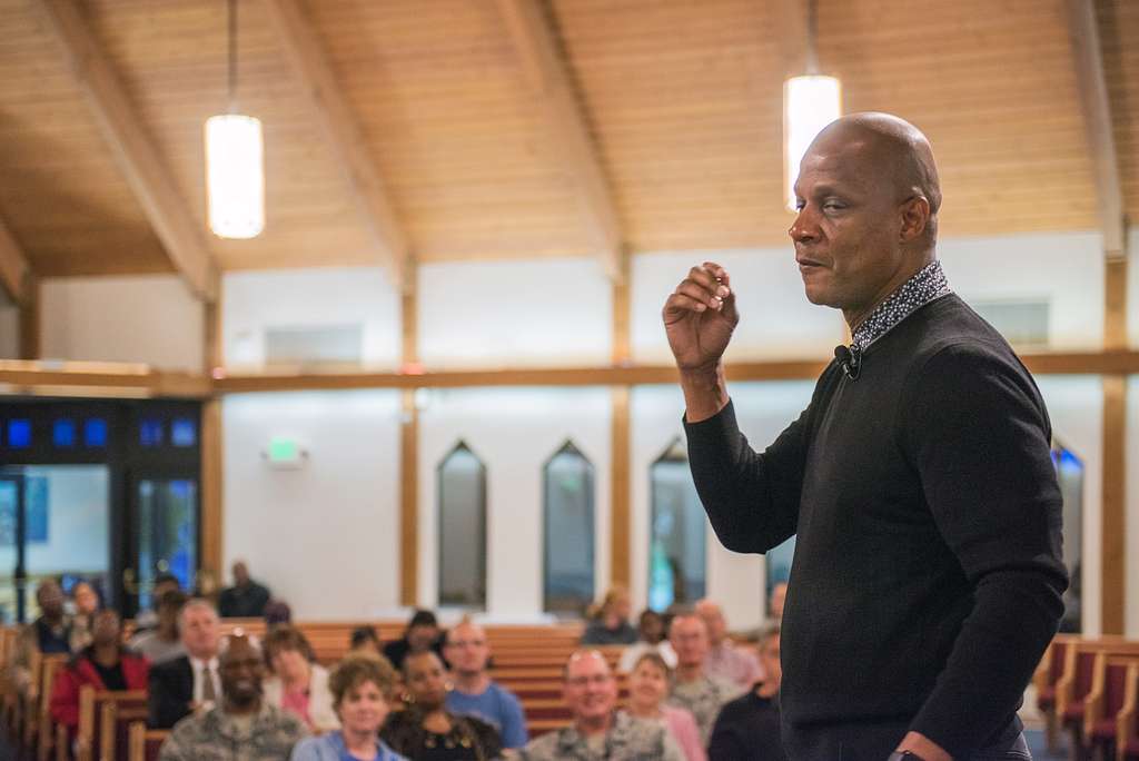 From left, U.S. Air Force Col. John Klein, 60th Air Mobility Wing  commander, former Major League Baseball player Darryl Strawberry, and Col.  Kenneth Reyes, 60th Air Mobility Wing chaplain, pose for a