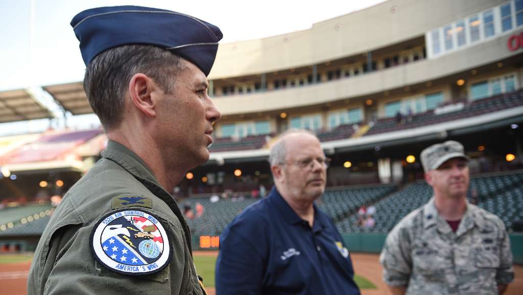 Tinker Air Force Base - Brady LeDonne, a member of the entertainment team  for the the Oklahoma City Dodgers Minor League Baseball team, and 'Brix'  one of the OKC Dodgers mascots pose