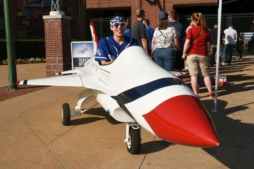 Tinker Air Force Base - Brady LeDonne, a member of the entertainment team  for the the Oklahoma City Dodgers Minor League Baseball team, and 'Brix'  one of the OKC Dodgers mascots pose