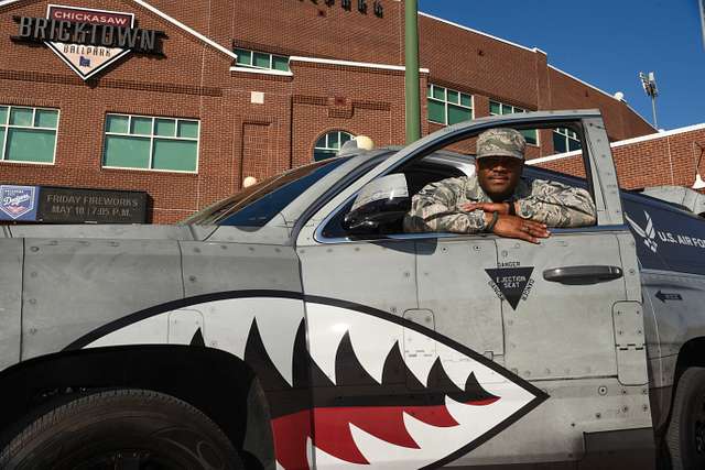 Tinker Air Force Base - Brady LeDonne, a member of the entertainment team  for the the Oklahoma City Dodgers Minor League Baseball team, and 'Brix'  one of the OKC Dodgers mascots pose