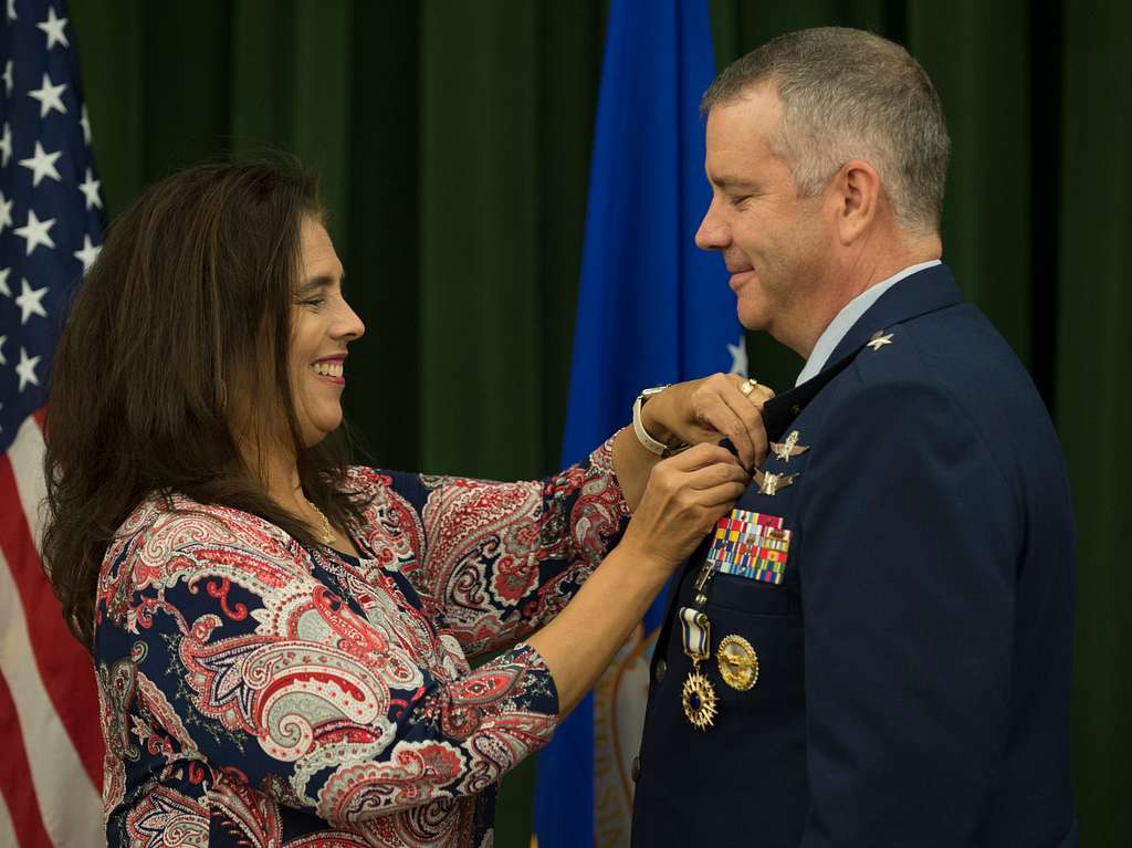 Leslie Butikofer fastens the retirement pin on Brig. - NARA & DVIDS ...