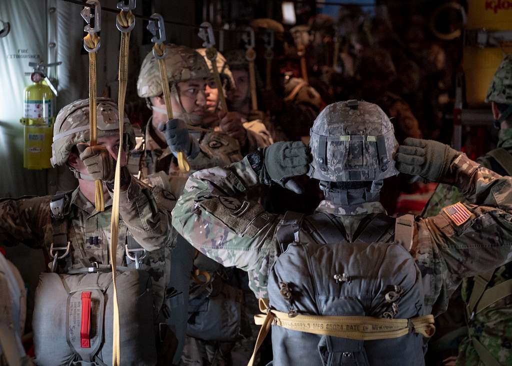 A U.S. Army jumpmaster signals paratroopers of the - NARA & DVIDS ...