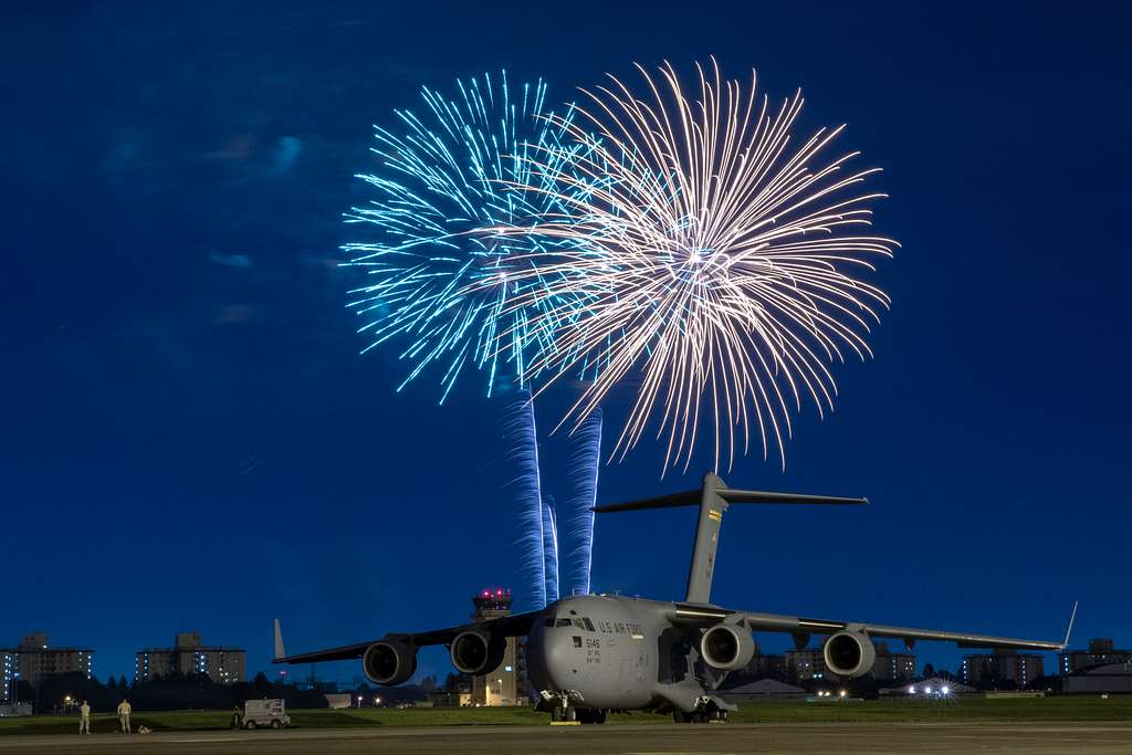 Fireworks explode behind a U.S. Air Force C17 Globemaster NARA