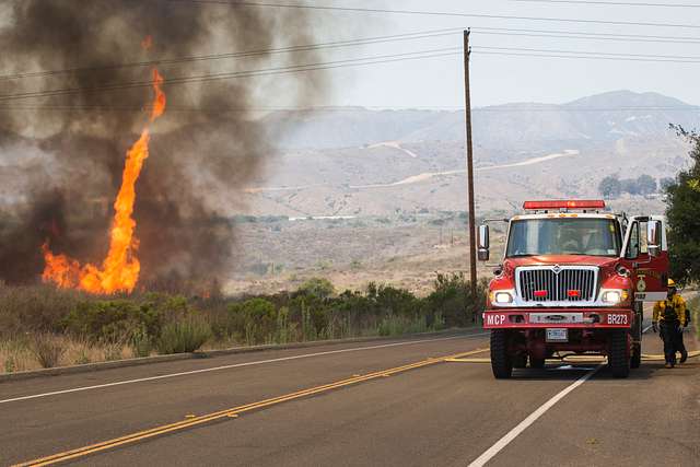 Staley Myers (right), a captain with San Diego Fire Department briefs  Marines and firefighters during a training exercise in San Diego, June 21.  Marine Corps Air Station Miramar Aircraft Rescue and Firefighting