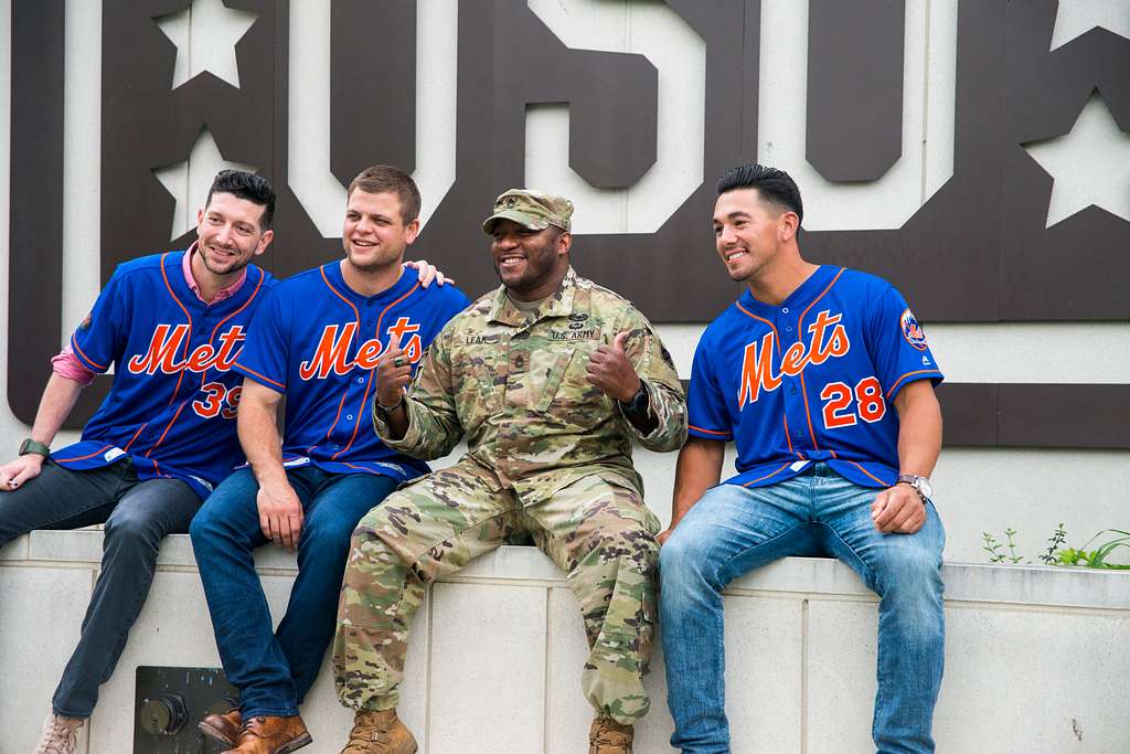 Active duty personnel and their families posed for photos with the New York  Mets mascot, Mr. Met, during a meet and greet event at the United Service  Organizations Warrior and Family Center