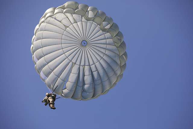 A U.S. Army Paratrooper descends using his MC-6 parachute - NARA ...