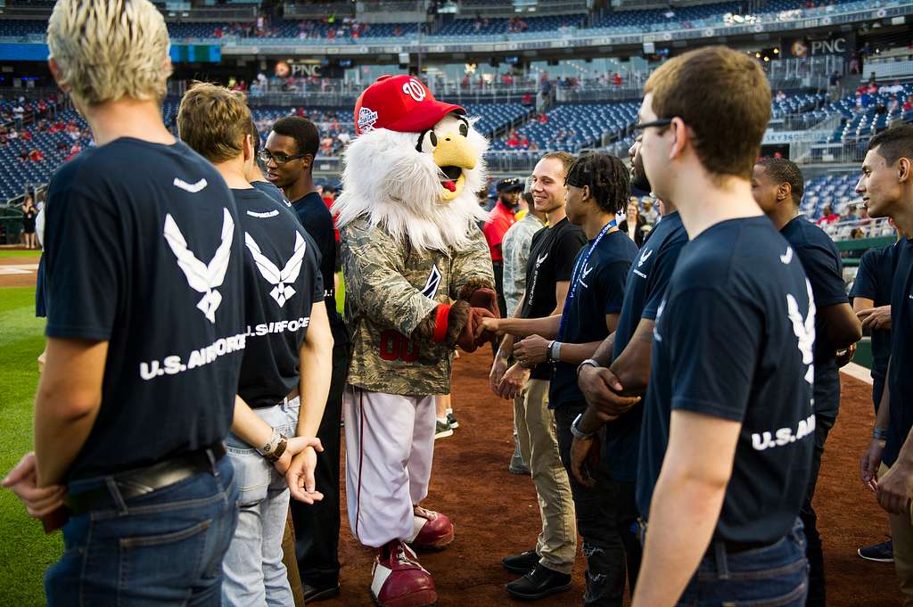 WASHINGTON (May 14, 2019) Screech, the Washington Nationals mascot, shakes  hands with Personnel Specialist 1st Class Angelita Baggoo, Navy Reserve  Sailor of the Year, at Nationals Park in Washington, D.C. - PICRYL 