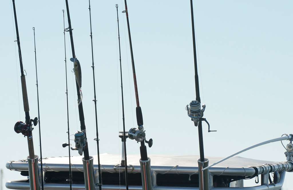 Fishing poles used for sport fishing line the outside - PICRYL