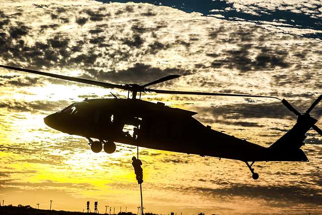 A silhouette of a UH-60 Blackhawk helicopter assigned - PICRYL Public ...