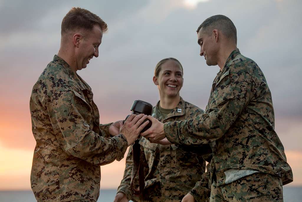 Sgt. Maj. Carlos Ruiz (center), outgoing sergeant major - NARA