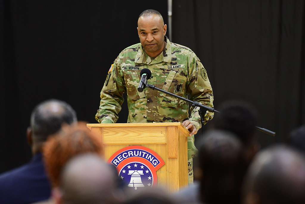 Brig. Gen. Kevin Vereen, deputy commanding general operations for U.S. Army  Recruiting Command, prepares to give the Oath of Enlistment Nov. 12 to  nearly 100 Future Soldiers during halftime of the Washington