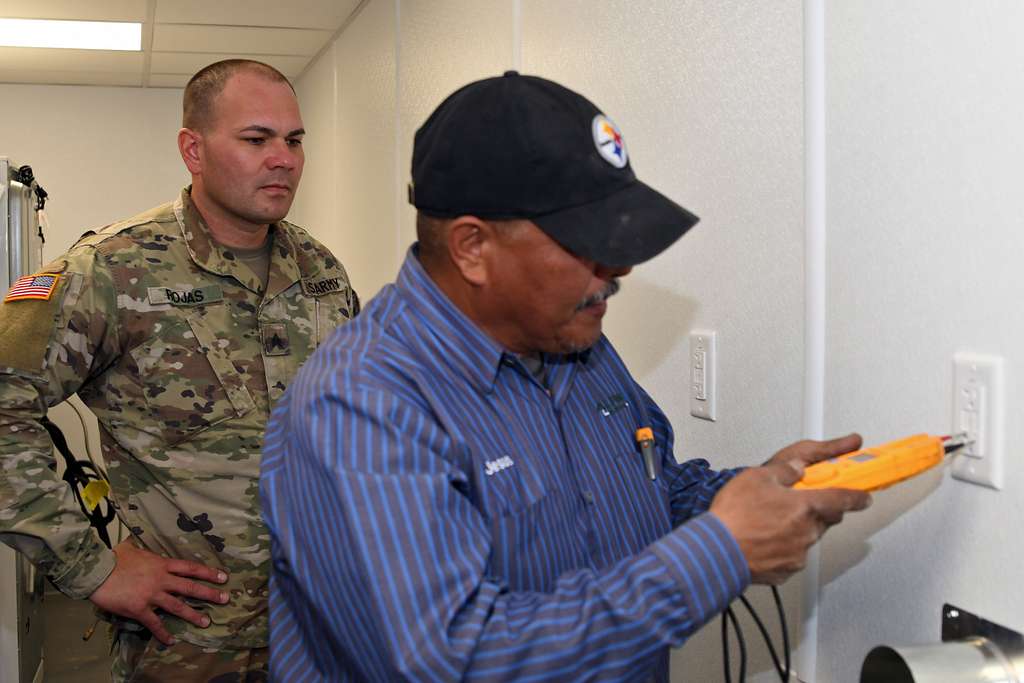 Sgt. Maj. Carlos Ruiz (center), outgoing sergeant major - NARA