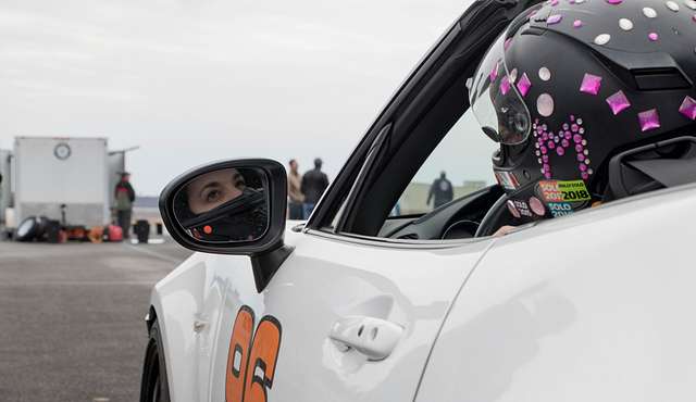 A racer checks to make sure her car is in proper order - NARA & DVIDS ...