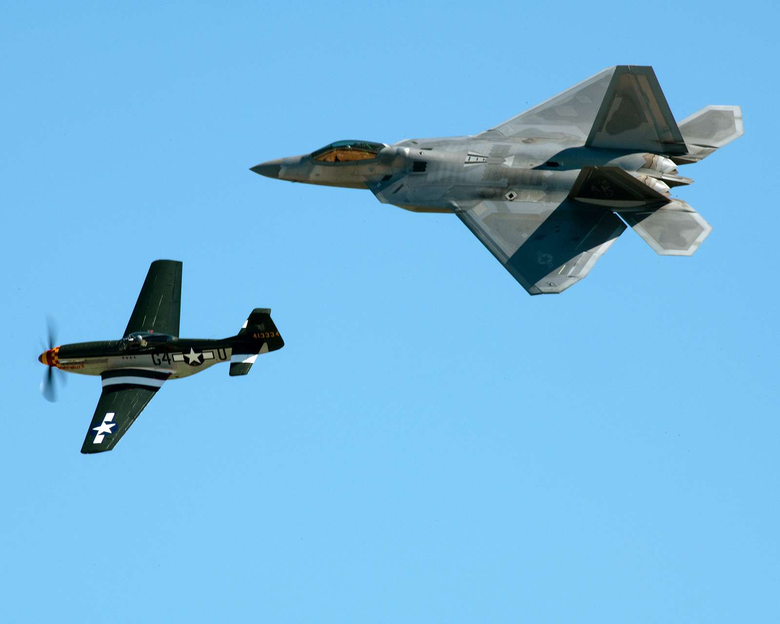 An F-22 Raptor and a P-51 Mustang performs during the - NARA & DVIDS ...