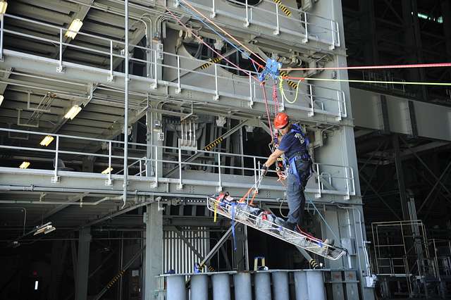 A firefighter practices advanced technical rescue techniques - NARA ...