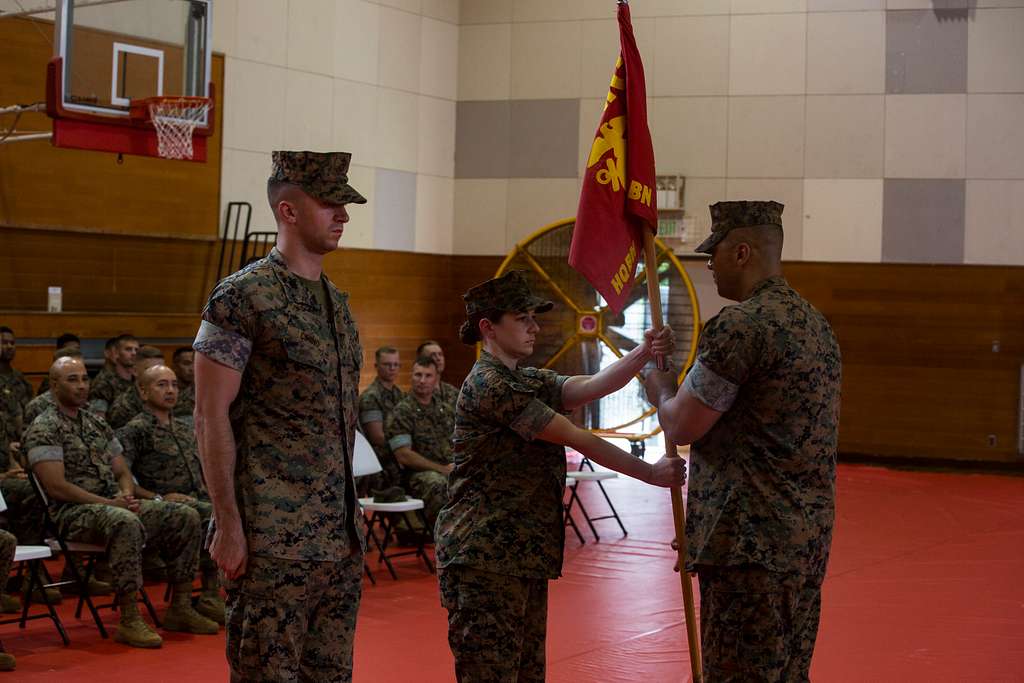 U.S. Marine Corps Capt. Catherine Lascola hands the - PICRYL - Public ...